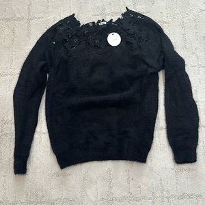 En Crème knitted sweater in size s/m.